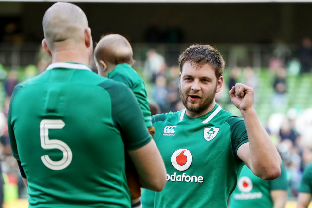 Iain Henderson celebrates winning with Devin Toner and his son Max after the game