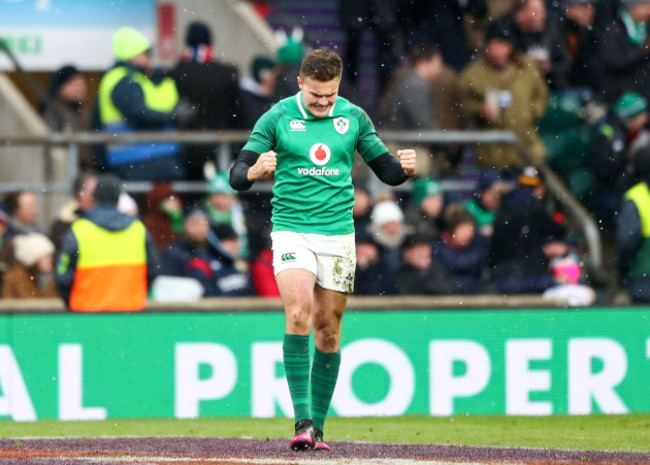 Jacob Stockdale celebrates scoring their third try