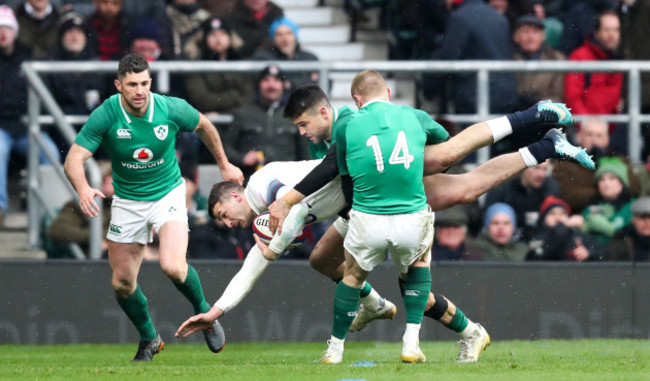 Jonny May is tackled by Ireland's Keith Earls and Conor Murray