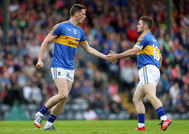 Conor Sweeney celebrates kicking a point with Liam McGrath