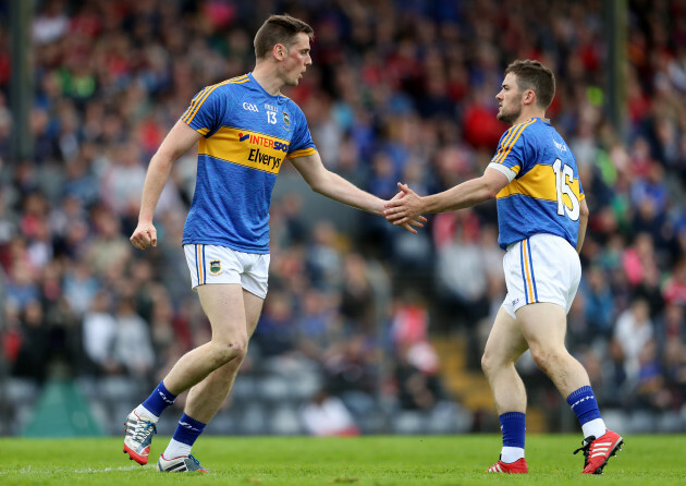 Conor Sweeney celebrates kicking a point with Liam McGrath