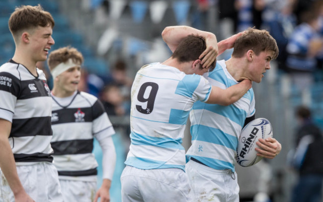 Liam McMahon is congratulated by team mate Louis O'Reilly after scoring a try