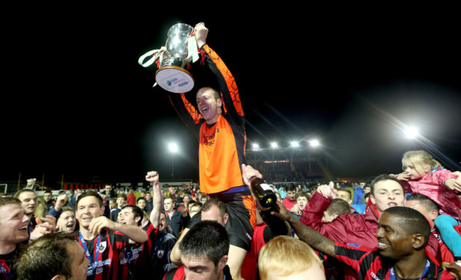 Paul Hunt celebrates with the First Division trophy