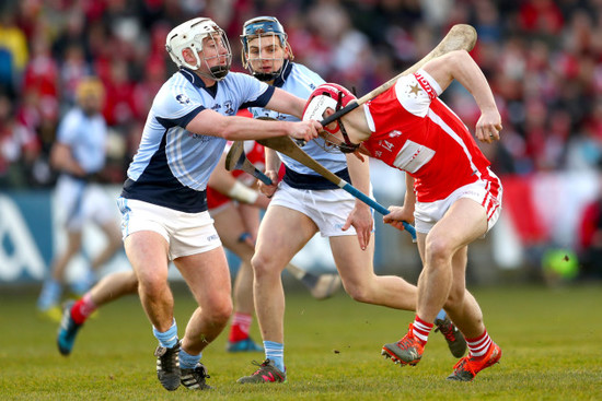 Kieran Kennedy and Mike Casey tackle Con O'Callaghan