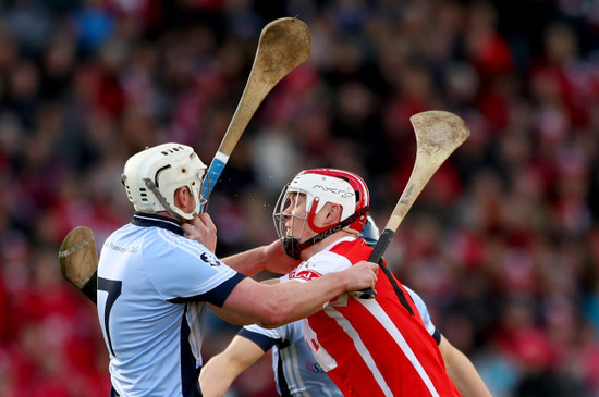 Kieran Kennedy and Mike Casey tackle Con O'Callaghan