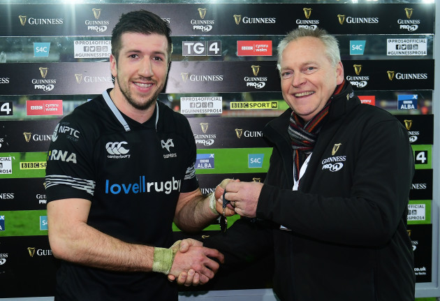 Justin Tipuric receives his man of the match medal from Paul Willoughby