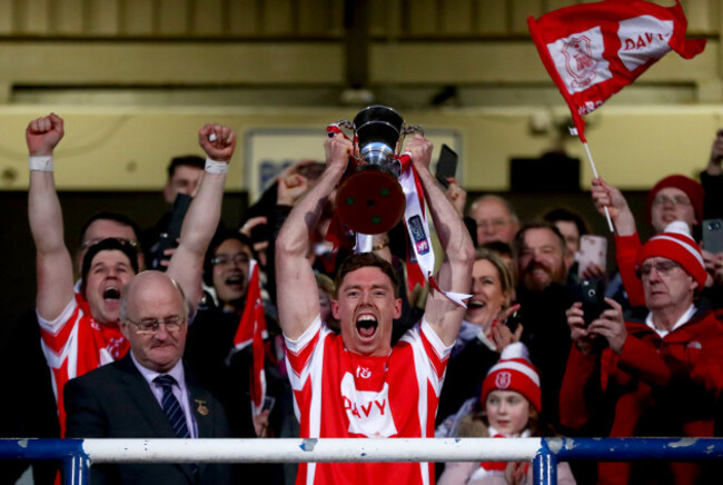 Paul Schutte lifts the trophy