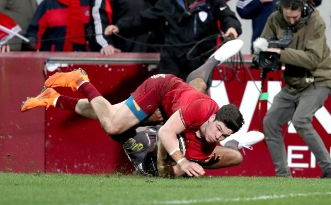 Alex Wootton scores a try despite the efforts from Tom Varndell