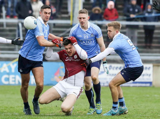 Damien Comer tackled by James McCarthy and John Cooper