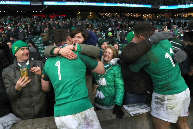 Cian Healy and Jacob Stockdale celebrate after the game with family members