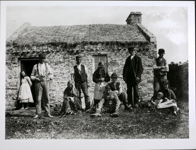 Natives of Gweedore, Donegal outside their thatched smallholding FRONT