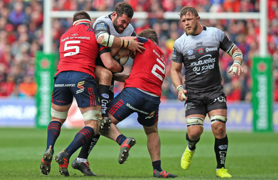 Florian Fresia tackled by Billy Holland and Rhys Marshall