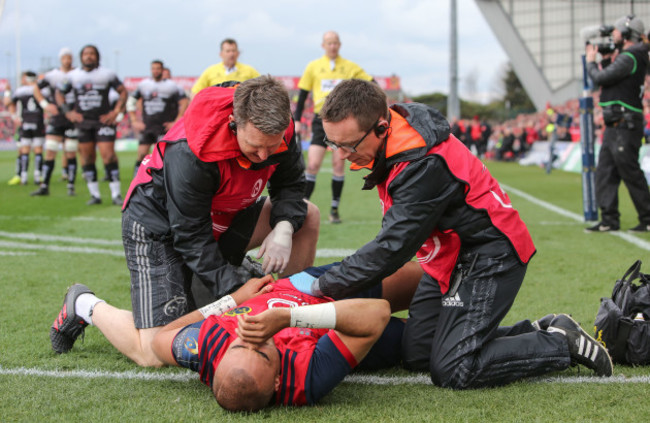 Simon Zebo receives treatment after a knock