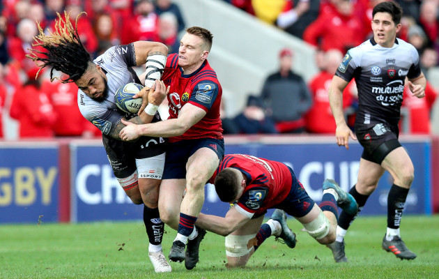 Ma'a Nonu tackled by Jack O'Donoghue and Rory Scannell