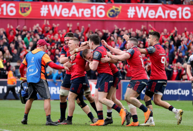 Andrew Conway celebrates his try with teammates