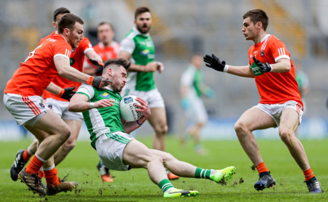 Barry Mulrone tackled by Brendan Donaghy