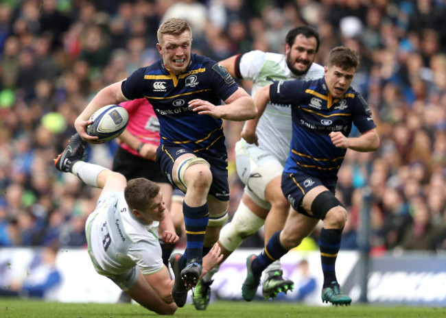 Dan Leavy runs in a try despite the efforts from Owen Farrell