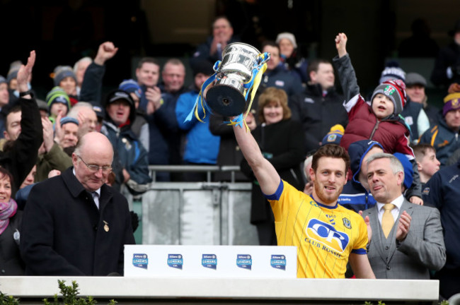 Conor Devaney lifts the league trophy