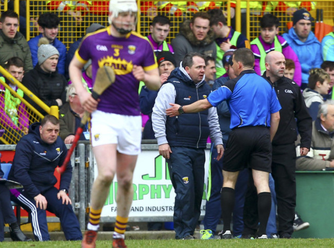 Davy Fitzgerald is spoken to by Colm Lyons