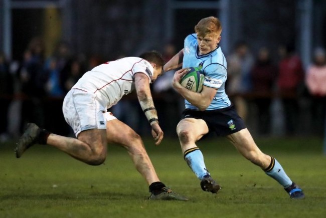 Tommy O’Brien is tackled by Kyle Dixon