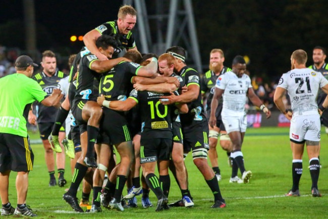 Ngani Laumape celebrates scoring a late try to win his team the game with teammates