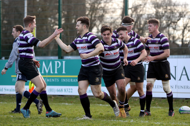 Sam Coughlan Murray celebrates his try with teammates