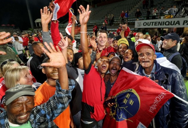 CJ Stander is surrounded by both sets of fans after the game