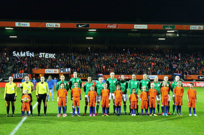 The Ireland team stands for the national anthems