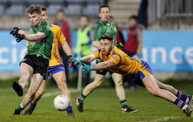 Harry Ladd scores a goal despite the efforts of Eoin Murchan