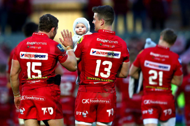 Leigh Halfpenny celebrates with Scott Williams and Scott's son Seb