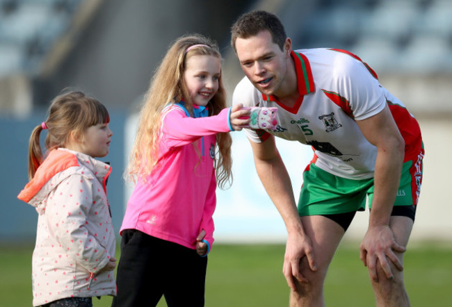 Dean Rock takes a selfie with a young fan after the match