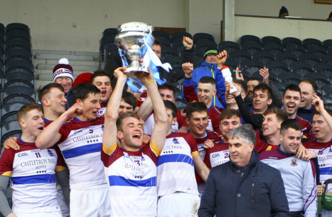 John McGrath lifts the cup