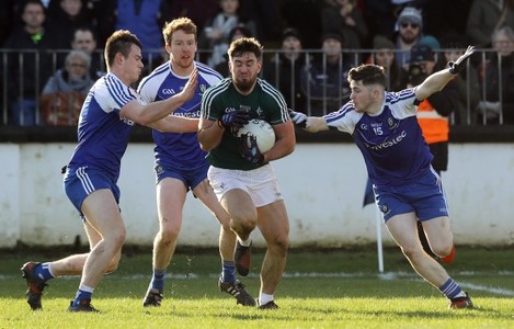 Ben McCormack tackled by Barry Kerr and David Garland