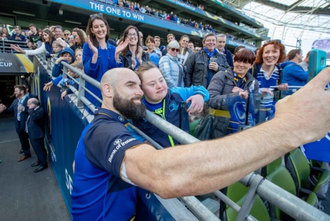 Scott Fardy takes a picture with Jennifer Malone after the game