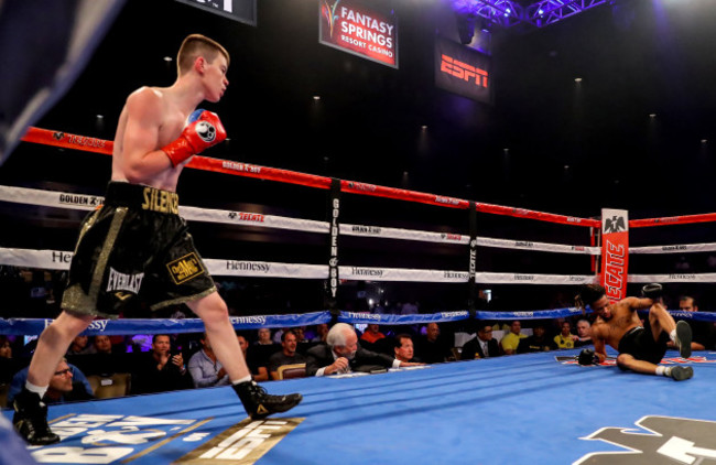 Aaron McKenna looks on as Keasen Freeman attempts to get up from the canvas