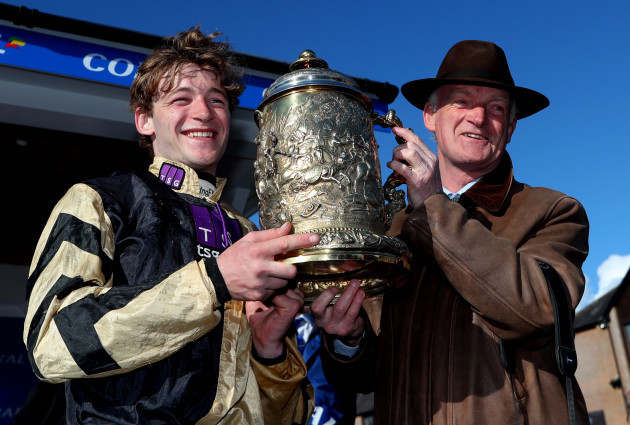 David Mullins and Willie Mullins celebrate with the Gold Cup after he won on Bellshill
