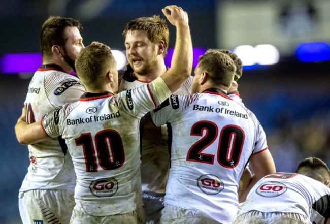 Iain Henderson celebrates scoring the winning try with teammates