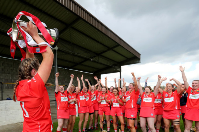 Sarah Harrington lifts the League 2 Trophy