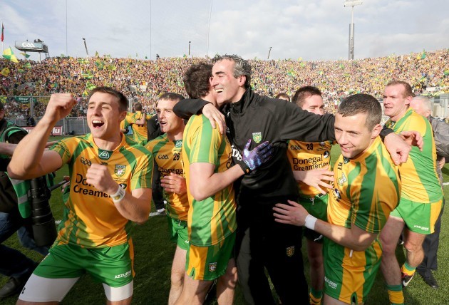 Jim McGuinness celebrates with players after winning the Sam Maguire