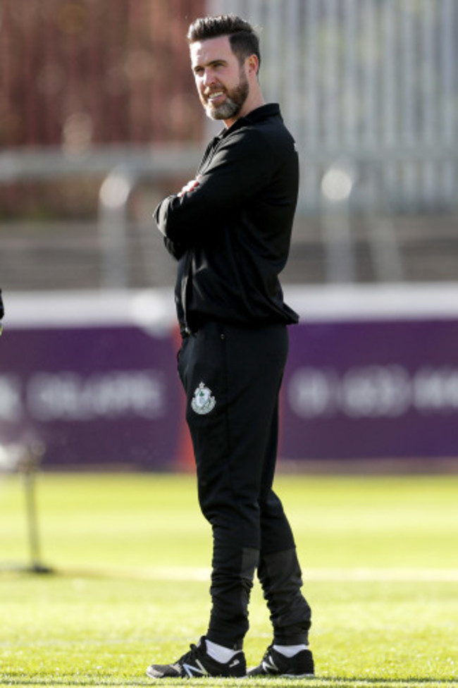 Stephen Bradley inspects the pitch ahead of the game