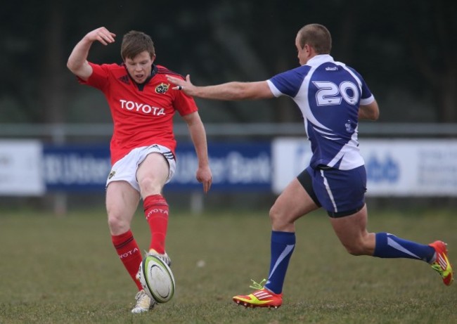 Munster's Jonny Holland clears under pressure