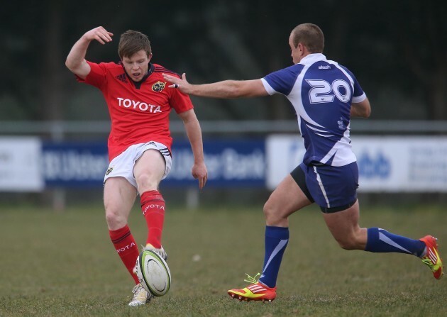 Munster's Jonny Holland clears under pressure