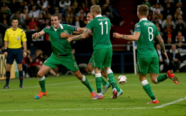 John O'Shea celebrates scoring a late equaliser against Germany