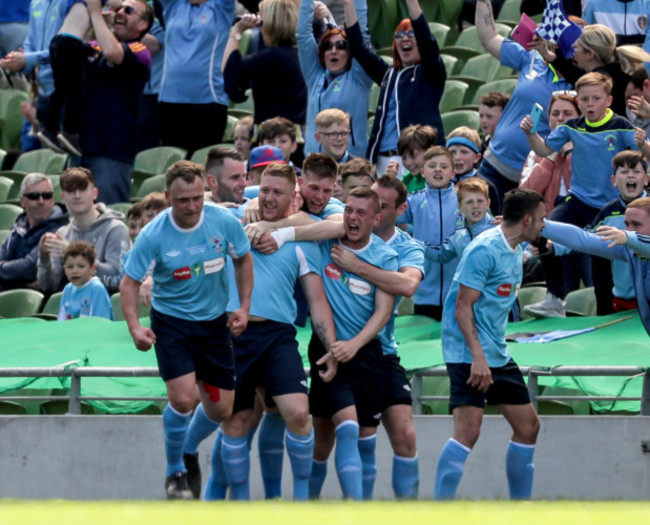 Paul Spot Murphy celebrates with teammates after scoring a goal