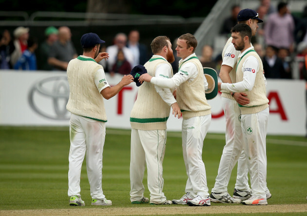 Paul Stirling and William Porterfield embrace after the game