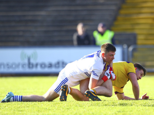 Graham Brody looks on as Naomhan Rossiter scores a goal