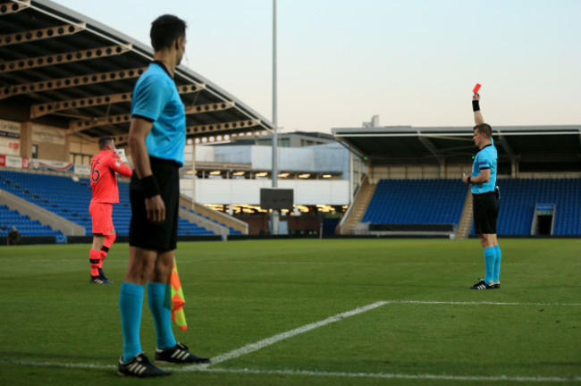 James Corcoran is shown a red card by Zbynek Proske during the shoot out