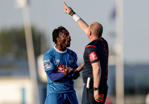 Stanley Aborah receives a red card from Graham Kelly