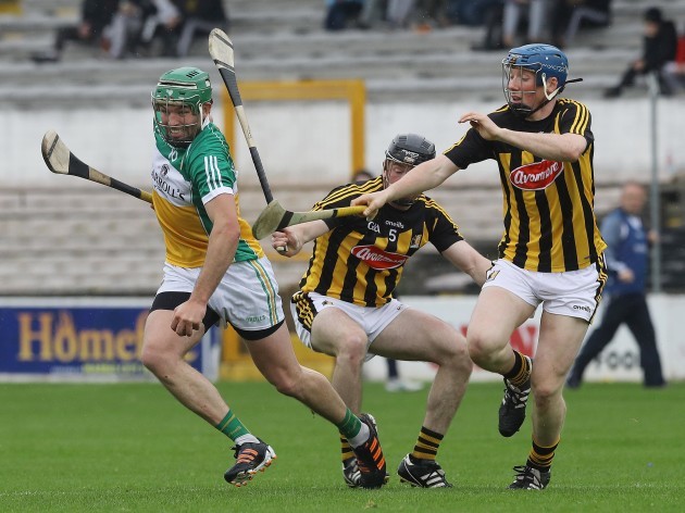 Conor Delaney and John Donnelly tackle Joe Bergin