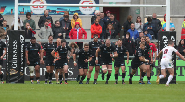 Osprey's team run at Ulster’s John Cooney as he kicks a conversion